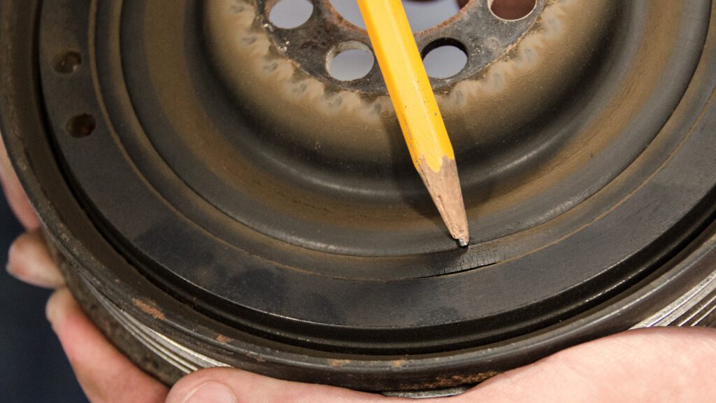 Crack, missing or bulging rubber is an early warning sign that the stock harmonic damper should be upgraded to a Fluidampr performance damper.
