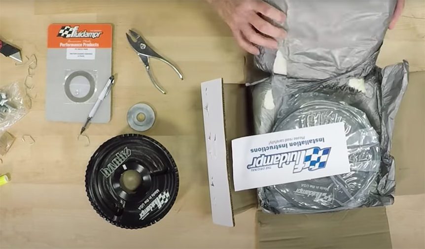 A person is putting together a kit for a motorcycle.